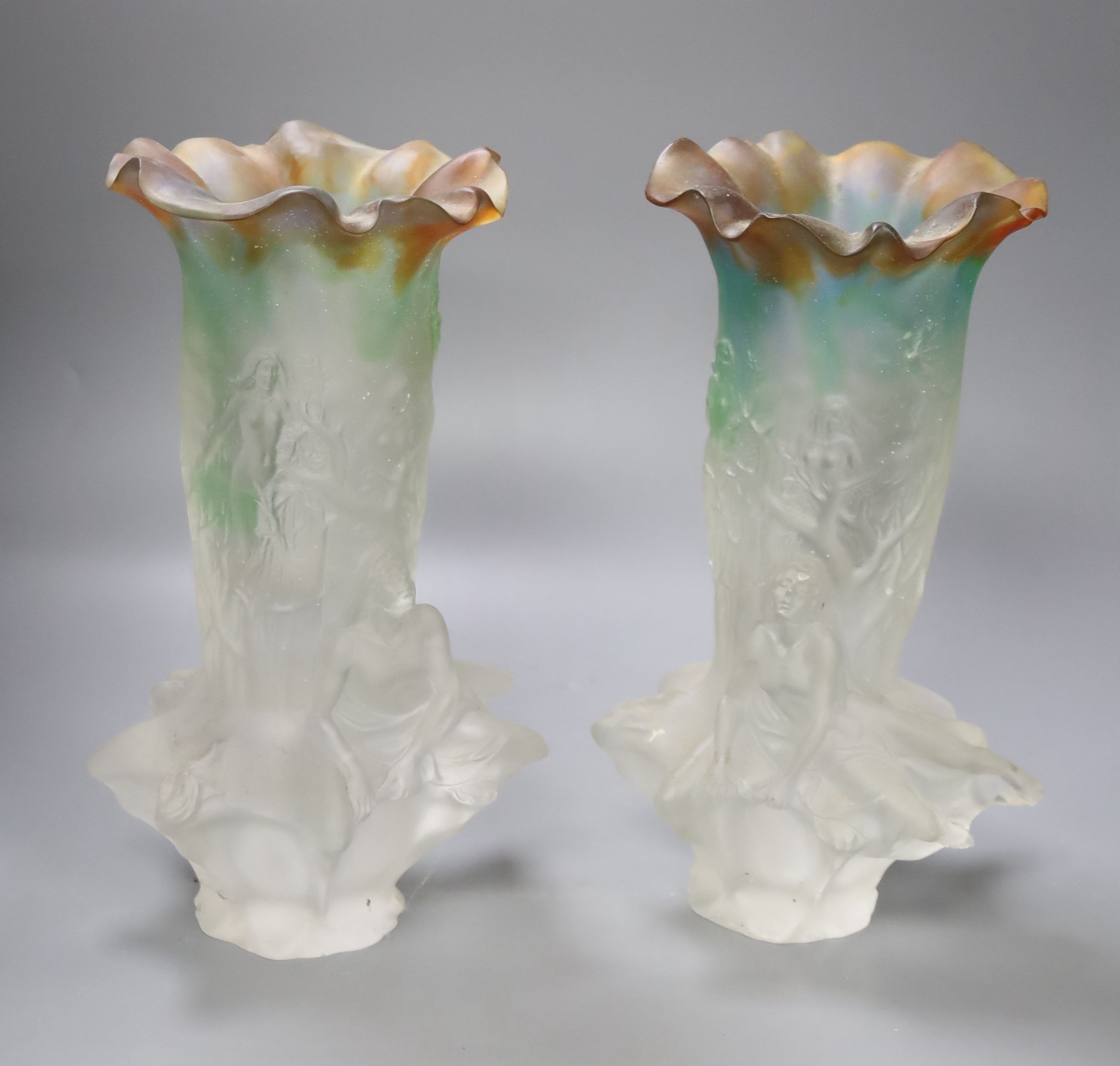 A pair of Daum style vases with recumbent figures, 31cm high